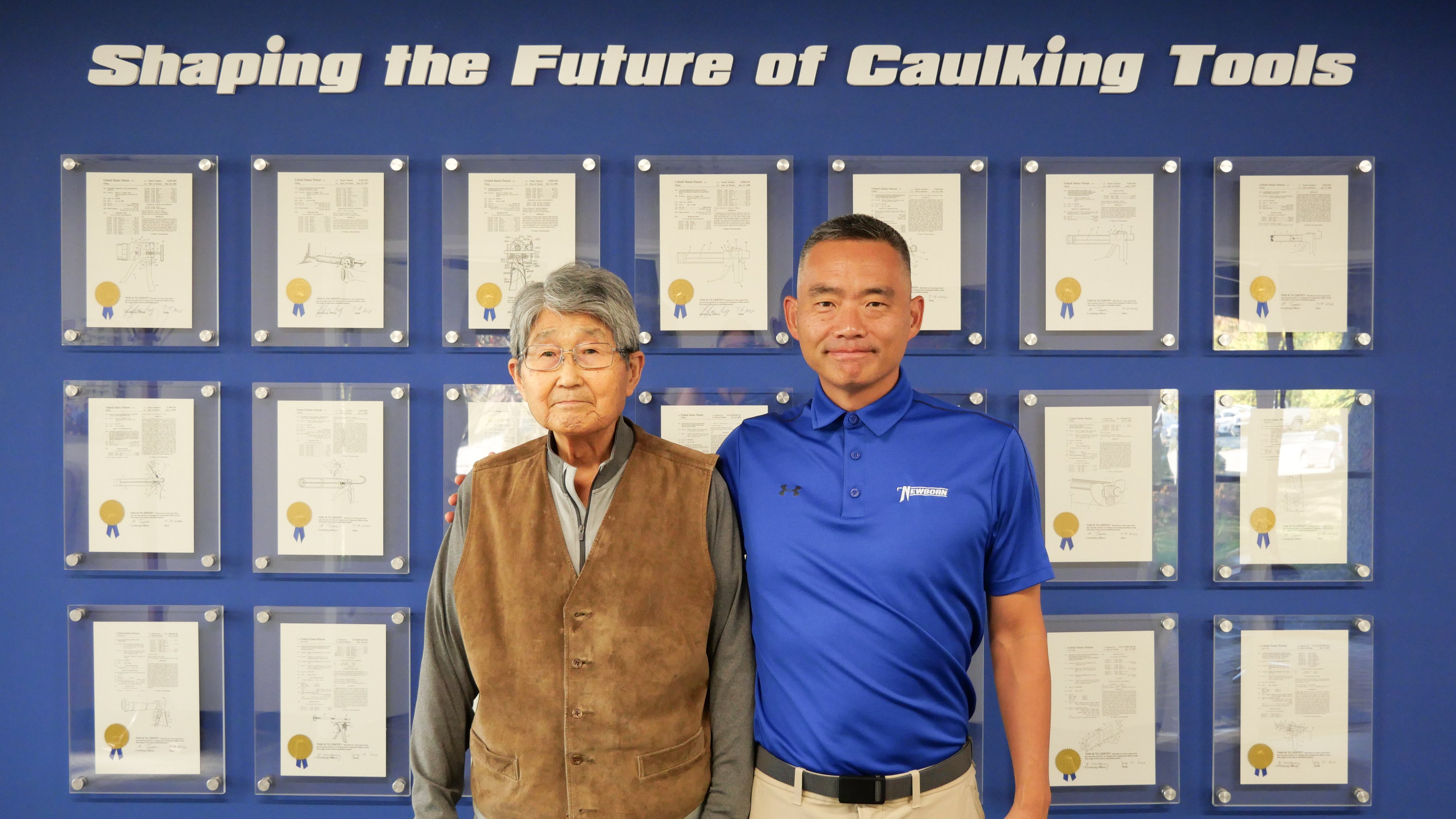Albert and Peter in front of patent wall — Shaping the Future of Caulking Tools