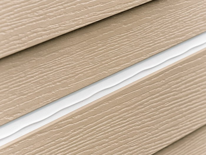 AI shot reference standing in for photography. Exterior, daylight. A siding lap or panel transition with the bead run and tooled.